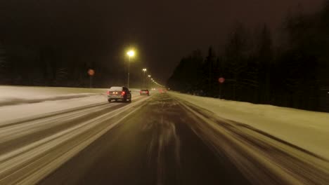 POV-driving-shot-along-a-highway-in-Helsinki-at-night