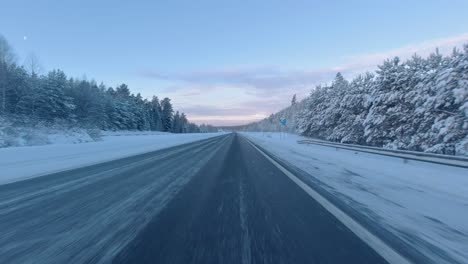 Timelapse-shot-driving-past-cars-and-delivery-trucks-on-a-Helsinki-highway