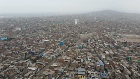 Aerial-Shot-of-Ventanilla,-a-crowded-and-poor-slum-in-Lima,-Peru