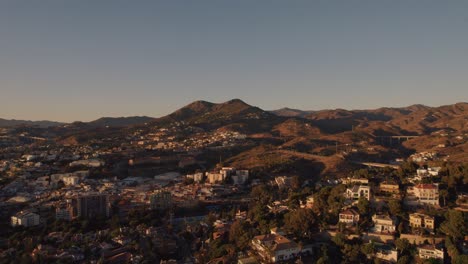 Aerial-forward-moving-drone-shot-over-El-Candado-hills-in-Malaga-Spain