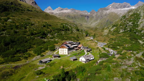 Aerial-view-orbiting-Berliner-Hütte-historic-alpine-mountain-refuge-hut-in-the-Austrian-Zillertal-alps