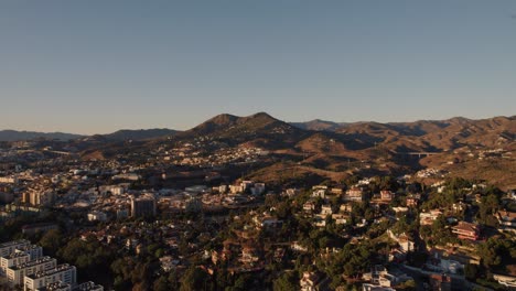 Aerial-forward-moving-drone-shot-over-El-Candado-city-in-Malaga-Spain