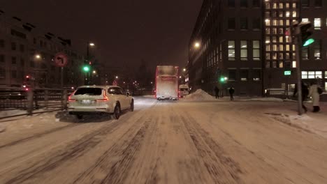 POV-shot-driving-through-downtown-Helsinki-at-nighttime