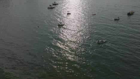 Aerial-Drone-shot-of-sailing-tourism-boats-in-Hong-Kong-waters,-China