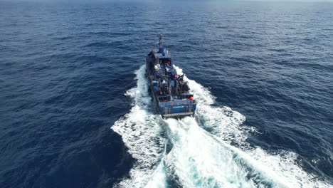 Aerial-shot-at-a-short-distance-from-a-customs-police-boat-at-a-short-distance-and-at-high-speed