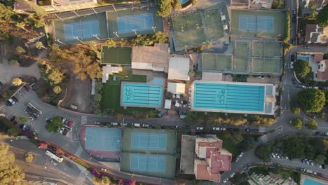 Aerial-top-to-bottom-drone-shot-over-sport-center-in-El-Candado,-Malaga-Spain
