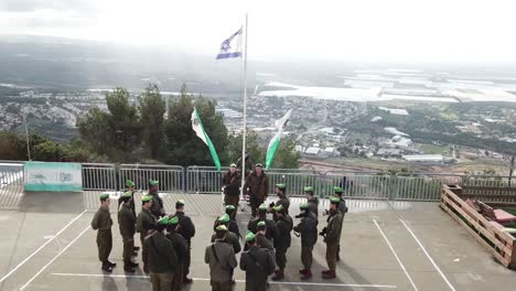 Israeli-Soldiers-saluting-the-country's-flag-in-front-of-the-headquarters
