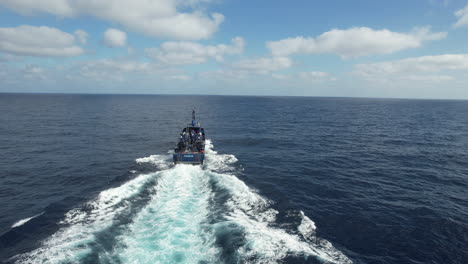 Fantastic-aerial-shot-from-the-stern-of-a-customs-police-patrol-boat-on-a-sunny-day