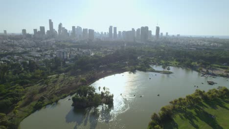 Slow-Push-in-at-high-altitude-above-Yarkon-Park-Tel-Aviv-on-a-sunny-day---Tel-Aviv-towers-in-the-background-#020