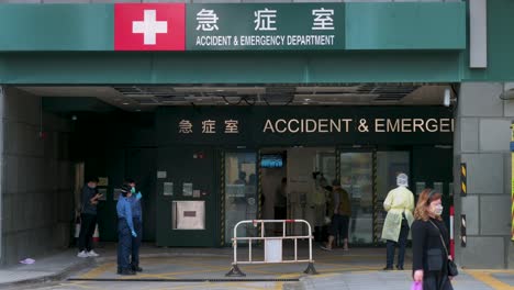 View-of-an-accident-and-emergency-room-entrance-of-a-hospital-as-healthcare-workers-standby-during-a-Covid-19-virus-variant-wave
