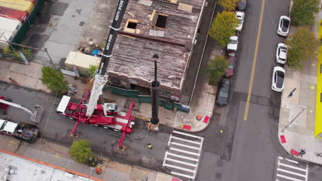 Crane-Truck-and-Workers-on-Streets-on-Brooklyn,-Aerial-View-of-New-Billboard-Construction-Site