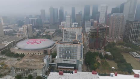 Aerial-view-around-the-Hilton-Americas-Houston-on-a-foggy-day---orbit,-drone-shot