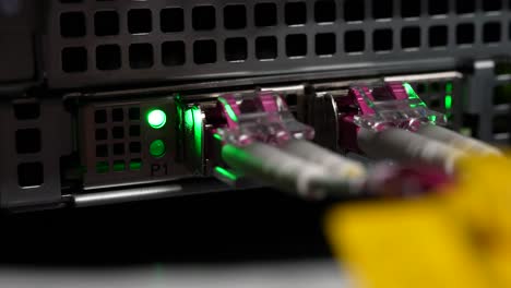 Fiber-optic-network-connectors-at-cloud-storage-server,-Close-up-shot