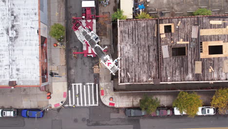 Birds-Eye-Aerial-View,-Truck-With-Crane-Holding-Support-Structure-For-Billboard