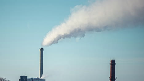 Factory-pipes-polluting-air,-creating-environmental-problems,-Industry-factory-pollution,-smokestack-exhaust-gases,-Timelapse