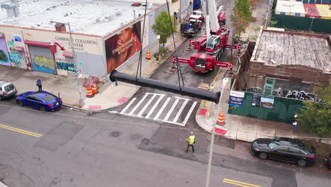Aerial-View,-Workers-and-Truck-WIth-Crane-Working-on-New-Billboard-Installation-in-Suburbs-of-Brooklyn-NYC-USA