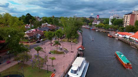 Aerial-view-dolly-in-of-catamarans-and-boats-parked-on-the-Tigre-River,-tigre-city,-cloudy-day