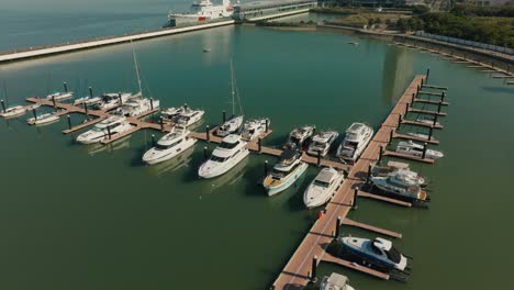 Rich-and-wealthy-lifestyle,-expensive-yachts-moored-at-pier