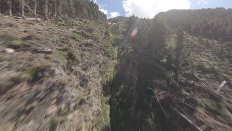 Epic-FPV-drone-shot-flying-up-mountain-over-trees-and-canyons-in-Puymorens