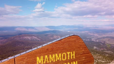 Close-up-gimbal-shot-booming-up-of-the-elevation-sign-at-the-summit-of-Mammoth-Mountain-in-California