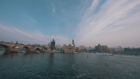 Charles-Bridge,-the-Vltava-river,-Prague-embankment-and-National-theatre-in-Prague-in-winter