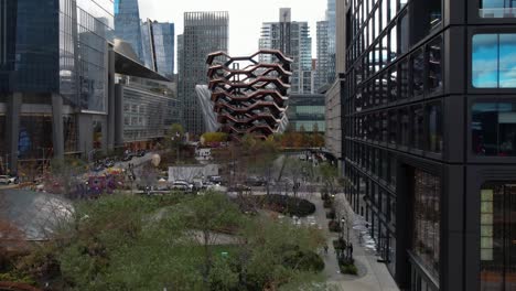 Elaborate-Vessel-modern-art-honeycomb-staircase-in-Hudson-yards-redevelopment-rising-aerial-view,-Manhattan,-New-York