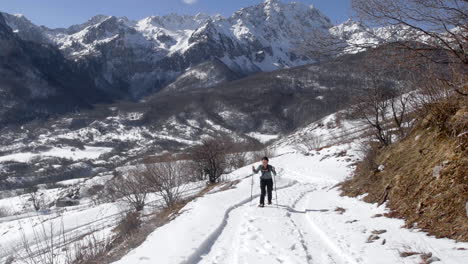 Young-Lady-Snowshoeing,-Hiking-In-Beautiful-Snowy-Nature,-North-Macedonia