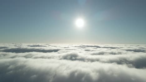 Drone-Flying-Above-Clouds-With-The-Late-Afternoon-Sunlight