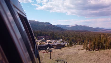 Gimbal-shot-from-gondola-as-it-approaches-the-Mammoth-Mountain-ski-lodge-in-California-during-the-summer