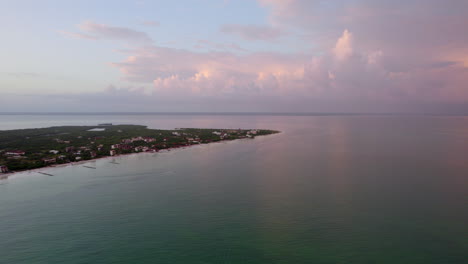 Drone-shot-view-of-the-beach-Water-island-with-purple-sky