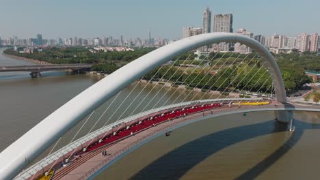 Tourists-walking-on-Guangzhou-Haixin-bridge-over-Pearl-River,-China