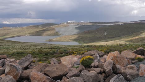 Clouds-drift-over-Letseng-Diamond-Mine-pond-in-Lesotho,-Africa