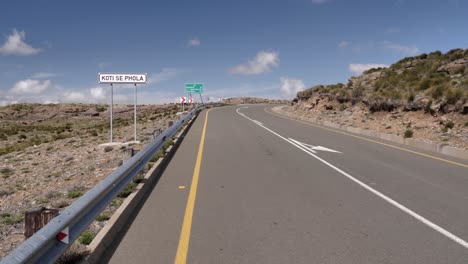 Koti-Se-Phola-road-sign-by-highway-in-highlands-of-Lesotho,-Africa