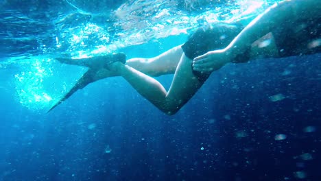 A-girl-snorkelling-in-crystal-clear-water-near-the-coast-of-Bali---Slow-motion
