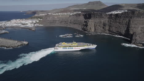 Fantastic-aerial-shot-of-a-ferry-arriving-at-the-port-of-Agaete-arriving-from-Tenerife