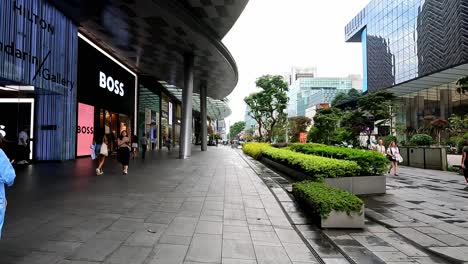 Outside-Luxury-Shopping-Mall-in-Dowtown-Singapore,-POV,-Dolly