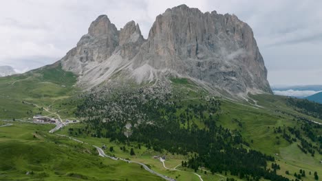drone-footage-shows-one-of-the-huge-high-rocky-mountains-rising-from-the-alpine-meadows-in-the-dolomites-mountain-range