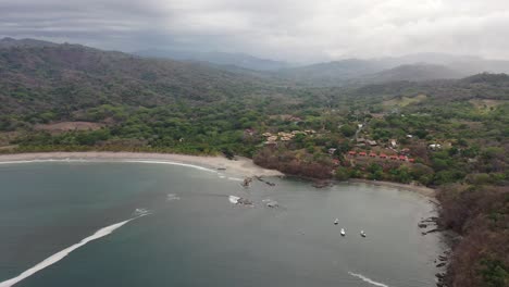 The-Playa-Carrillo-Beach-and-resorts-in-West-Costa-Rica,-Aerial-dolly-out-shot