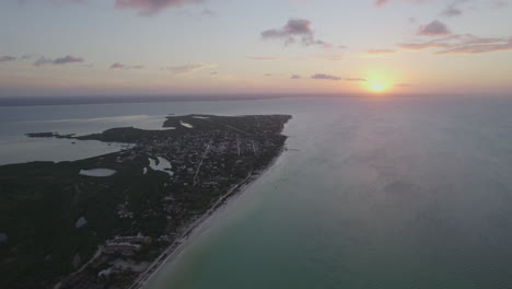 Drone-shot-view-of-sunset-on-beach-Water-island-with-purple-sky