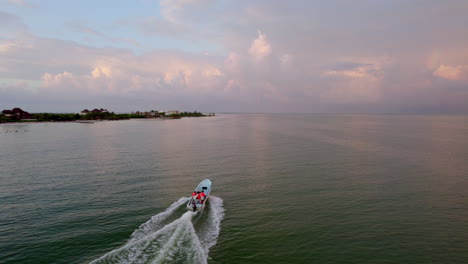 Drone-shot-view-of-speeding-boat-on-ocean-stock-clips