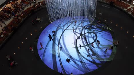 People-Plays-in-Disco-Spotlight-at-Mall,-Recreation-Area,-High-Angle-View,-Singapore