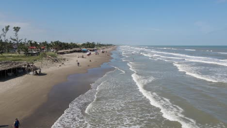 Pull-back-shot-of-the-beach-in-Tecolutla-Veracruz,-mexican-touristic-travel-destination