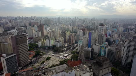 Aerial-view-over-the-cityscape-and-streets-of-Sao-Paulo,-partly-sunny-Brazil