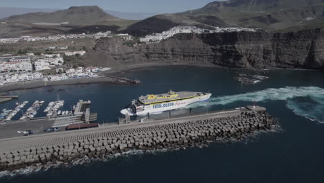 Fantastic-aerial-shot-of-the-Ferry-performing-a-docking-maneuver-in-the-port-of-Agaete-on-a-sunny-day