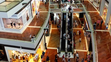 Escalators-in-Shopping-Mall-in-Sinapore,-High-Angle,-Tilt-Up