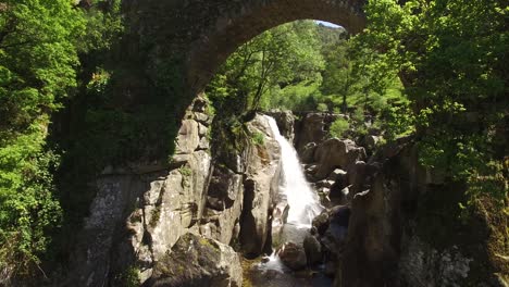 Drone-Footage-Bridge-Over-Waterfall