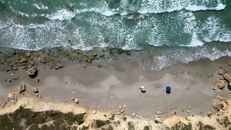 Rugged-Waves-at-Sandy-Beach-in-San-Giovanni-di-Sinis,-Sardinia---4k-Aerial-Birdseye