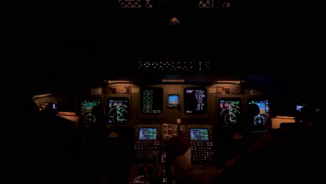 Jet-cockpit-view-in-a-real-flight-though-stormy-clouds-with-turbulence-and-lightnings,-night-light