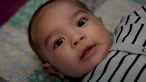 Close-Up-View-Of-Adorable-4-Month-Old-Indian-Baby-Boy-Smiling-And-Being-Expressive-Looking-At-Camera-Laying-On-Play-Mat