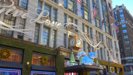 Low-angle-shot-of-Macy-shop-exterior-facade-beautifully-decorated-for-christmas-in-Manhattan,-New-York,-USA-at-daytime